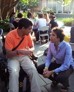 Two members having a conversation outdoors.