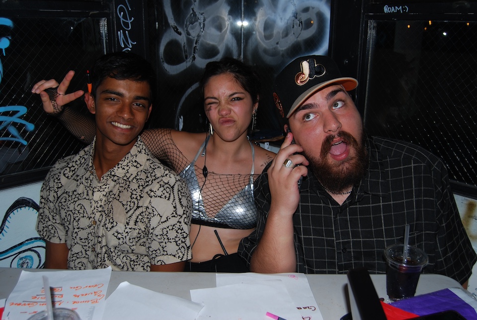Co-opers mugging for the camera, one holds up a peace sign