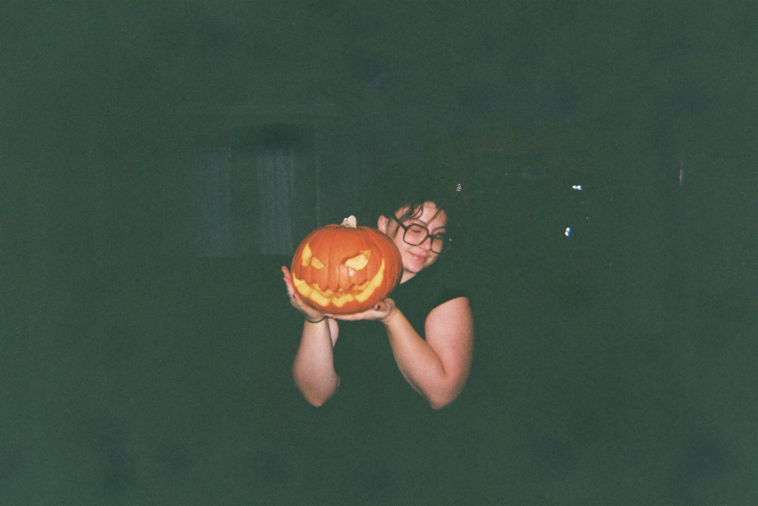 a wolf (a co-oper who lives at Wolf) holding a jack-o-lantern